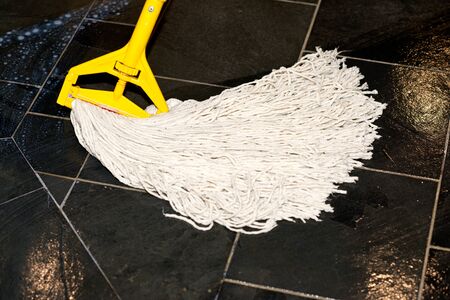 Waxing stone tile floor with no flat mapの写真素材