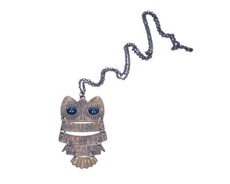Retro metal owl necklace on white backgroundの写真素材