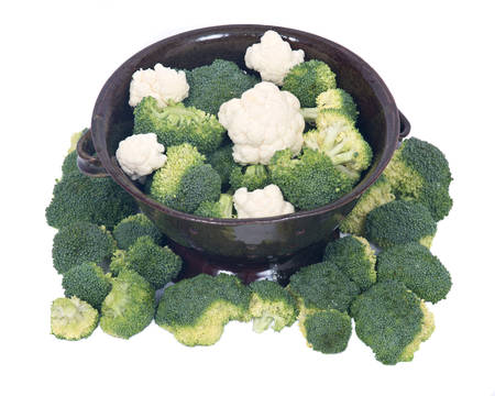 Organic broccoli and cauliflower in berry bowl on white backgroundの写真素材