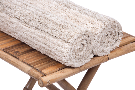 Cotton linen cut pile rug on natural bamboo tableの写真素材