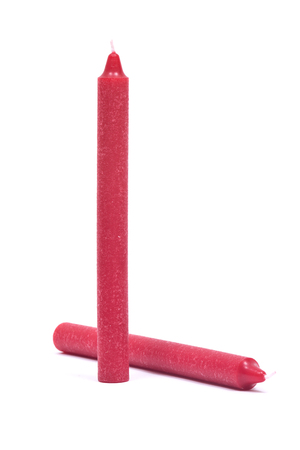 Red natural candle isolated on white backgroundの写真素材