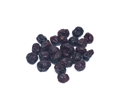 Whole organic dried cranberries isolated on white backgroundの写真素材