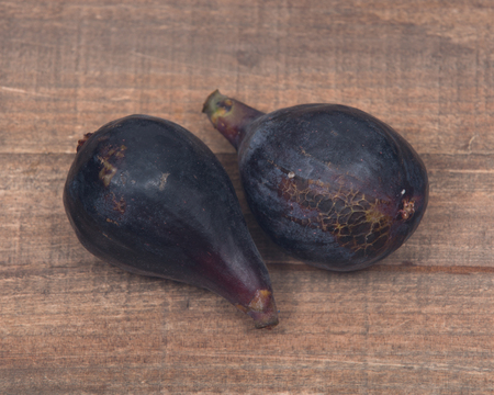 Fresh ripe organic figs on vintage wooden tray