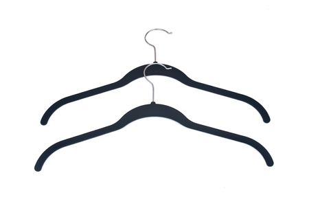 Vintage fabric covered plastic hangers isolated on white backgroundの写真素材