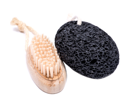 Natural bristle hand and nail wooden brush and volcanic pumice stone isolated on white backgroundの写真素材