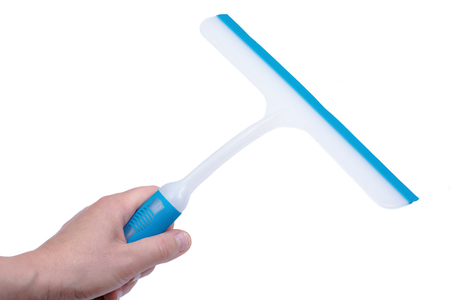 A squeegee or squilgee, tool with a flat, smooth rubber blade, used to remove or control the flow of...