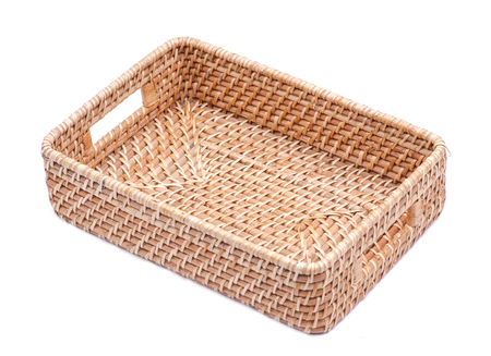 Handwoven in Indonesia exotic and functional rattan storage basket isolated on white background.の写真素材