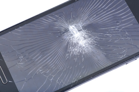 Accidentally cracked, damaged smartphone LCD screen isolated on white background