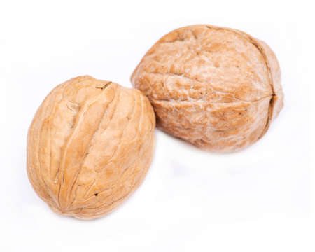 Brown raw organic walnut isolated on white background