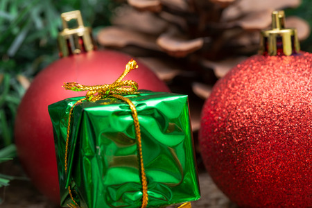Winter holiday decoration: tinsel garland Christmas gift decor, balls and pine conesの写真素材