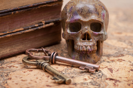 Panta rhei concept: Antique pocket watch, vintage keys and pile of old books on natural cork background.の写真素材