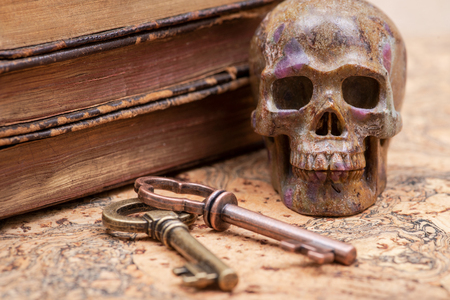 Panta rhei concept: Antique pocket watch, vintage keys and pile of old books on natural cork background.の写真素材