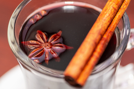 Hot mulled wine. Red hot wine with cinnamon, star anise, clove and citrus.の写真素材