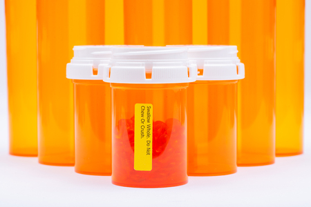 Docusate red capsules. Do not chew or crush Drink plenty of water while taking this medicine LABELS.の写真素材
