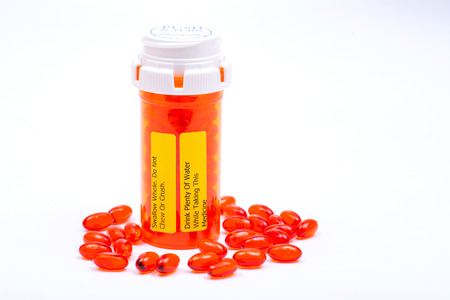 Docusate red capsules. Do not chew or crush Drink plenty of water while taking this medicine LABELS.の写真素材