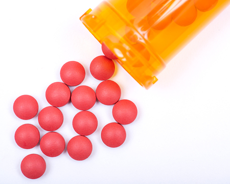 Laxative&stool softener. Sennosides & Docusate sodium coated tablets in orange plastic container.の写真素材