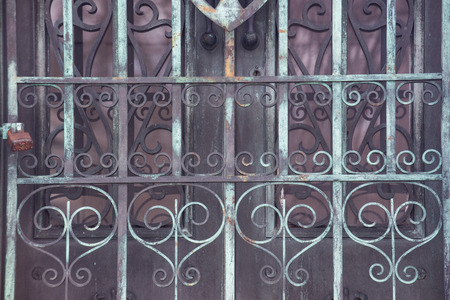 View of an old Antique Door locked with Rustic Vintage Padlock.