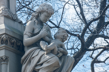 Beautiful Vintage Sculpture at old Catholic cemetery.の写真素材