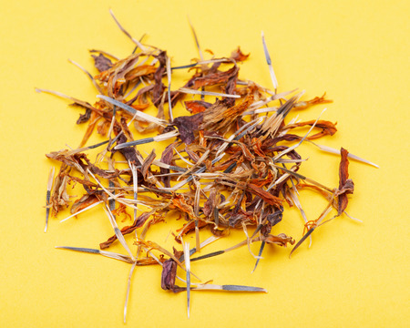 Pile of Marigold Dry Seeds (Mexican marigold, Aztec marigold, African marigold) on green background. Tagetes erecta. Daisy family.の写真素材
