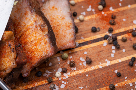 Oven Roasted Pork with spices on wooden cutting board.の写真素材