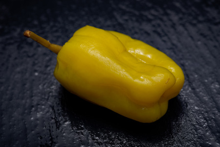 Pickled Golden Greek Peppers, Pepperoncini or Friggitelli (sweet Italian chili pepper) on natural...