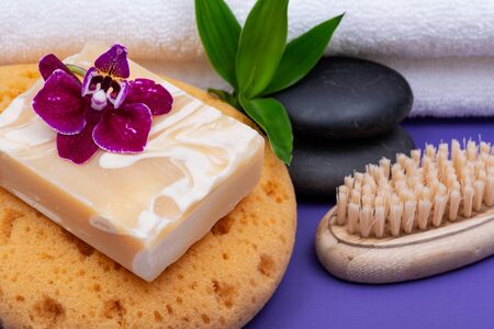 Spa Wellness Concept. Foam Sea Sponge, Almond Goat's milk Soap, Natural Bristle Wooden Brush, Basalt...