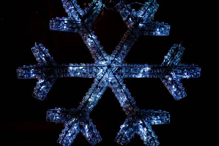 Outdoors Winter Christmas decoration concept: Light Garlands decorating the front of the building at night. Winter Holidays Tradition.の写真素材