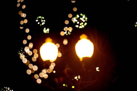 Vintage old style street light Lantern at night with Christmas decorations. Winter Holidays...
