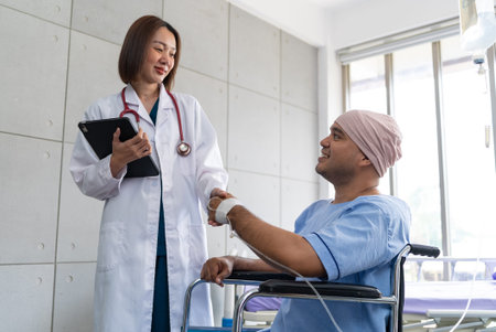 Asian man cancer patient smiling and happy with health checkup result after listening to oncologist...