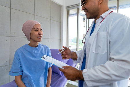 Asian woman cancer patient smiling and happy with health checkup result after listening to...