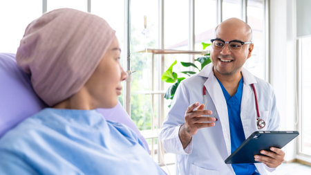 Asian woman cancer patient smiling and happy with health checkup result after listening to...
