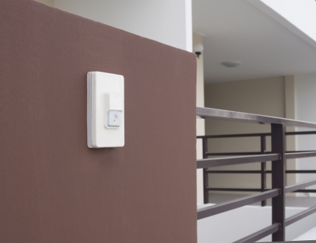 door bell ring plate with music note sign on brown wallの写真素材