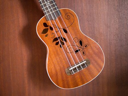 close up of hawaii ukulele ,  flower sound hole