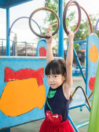 asian baby child playing on playgroundの写真素材