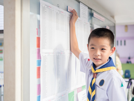 Asian kid find  the result announcement of exam s, primary schoolの写真素材