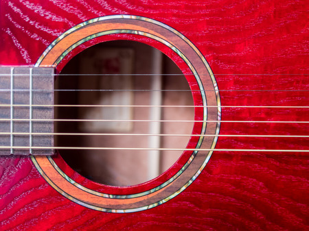 acoustic guitar sound hole, red wood, close up shotの写真素材