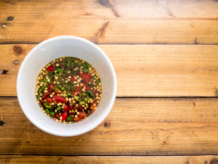 Chili and fish sauce , thai food, on wood tableの写真素材