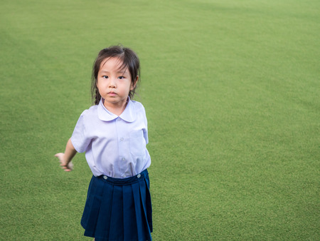 Happy kid, asian baby child playing on playground, after schoolの写真素材