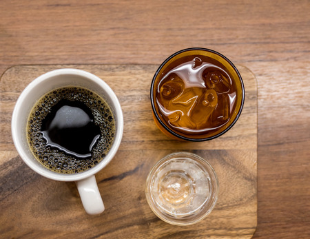 drip  coffee, serve with ice water and soda shot on wooden plate
