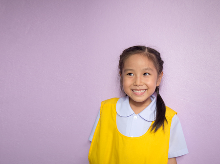 Portrait of Asian happy little girl , smile, school uniformの写真素材