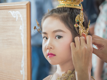 Mother help her daughter to dressed up her Thai traditional dress , National Costumesの写真素材