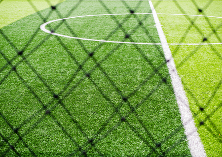 Soccer field, corner side, made from synthetic lawn, behind the net,selective focusの写真素材