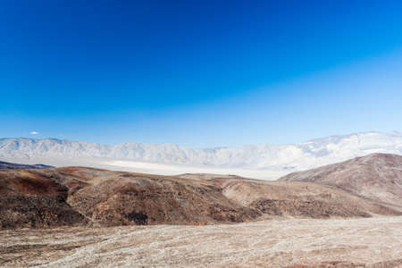 hilly landscape in Death Valley National Park with views of the Sierra Nevadaの写真素材
