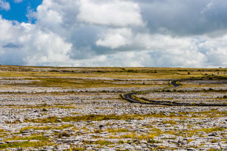 Burren region, Clare, Ireland - August 23, 2010: The Burren measures 250 square kilometres and is enclosed roughly within the circle made by the villages of Ballyvaughan, Kilfenora and Lisdoonvarna.の写真素材