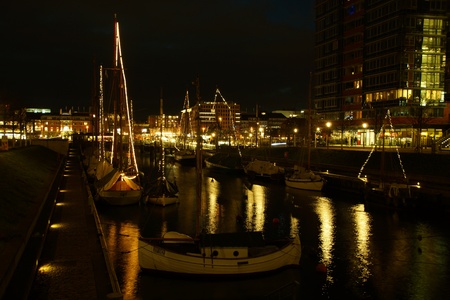 Kiel illuminated skyline at night with harbour and glowing skyのeditorial素材