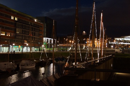 Kiel illuminated skyline at night with harbour and glowing skyのeditorial素材