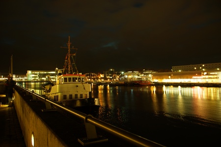 Kiel illuminated skyline at night with harbour and glowing skyのeditorial素材
