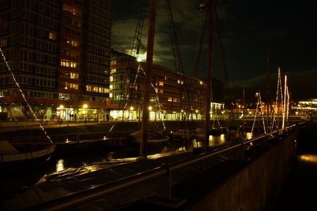 Kiel illuminated skyline at night with harbour and glowing skyのeditorial素材