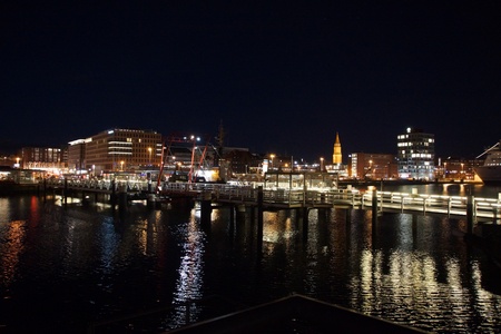 Kiel illuminated skyline at night with harbour and glowing skyのeditorial素材