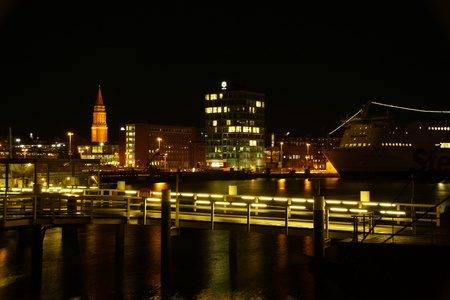 Kiel illuminated skyline at night with harbour and glowing skyのeditorial素材